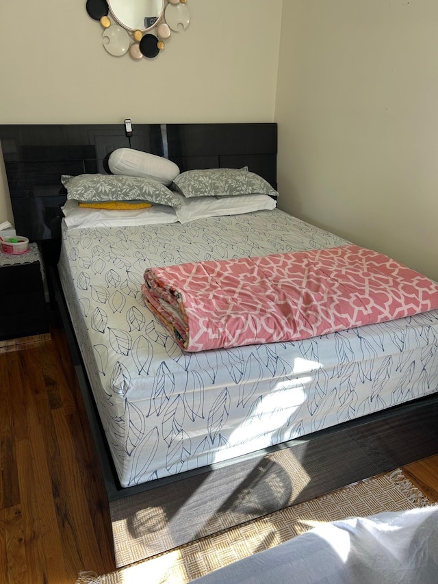 bedroom featuring wood finished floors