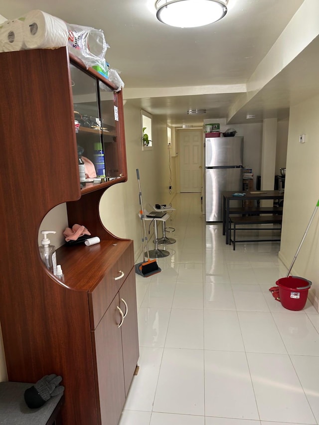 corridor with light tile patterned flooring