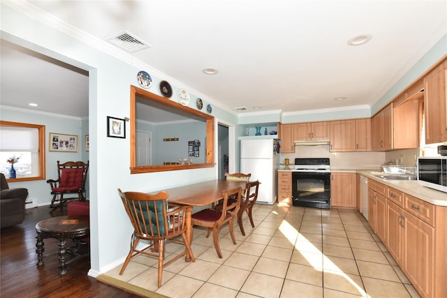 kitchen featuring visible vents, light countertops, ornamental molding, light tile patterned floors, and white appliances