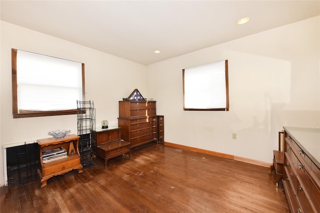 bedroom featuring dark wood finished floors, recessed lighting, and baseboards