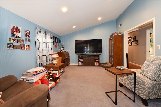 living room with visible vents, recessed lighting, carpet floors, baseboards, and vaulted ceiling