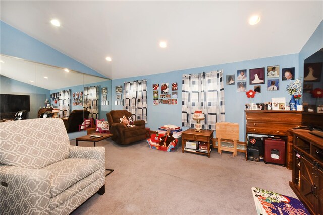 carpeted living area with recessed lighting and vaulted ceiling