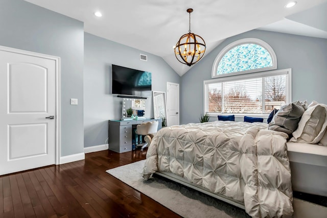 bedroom with visible vents, lofted ceiling, hardwood / wood-style floors, an inviting chandelier, and baseboards