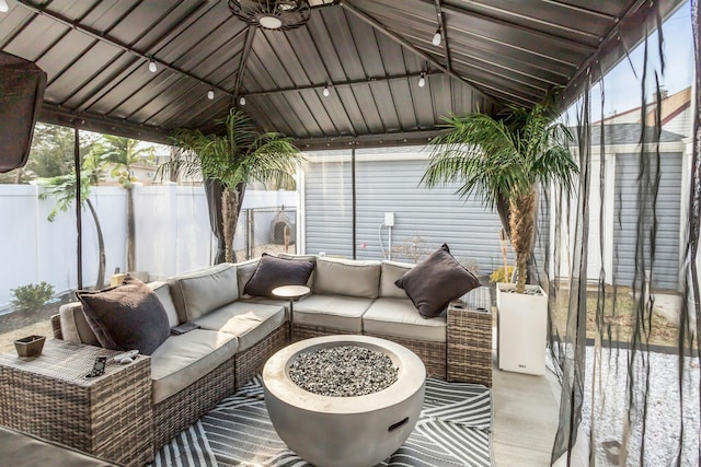 sunroom featuring track lighting and vaulted ceiling