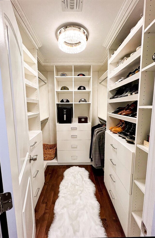 106 Hickory Ln, Levittown, NY 11756 - walk in closet featuring dark wood-style floors and visible vents
