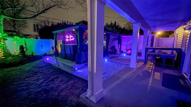 106 Hickory Ln, Levittown, NY 11756 - patio at twilight featuring a fenced backyard