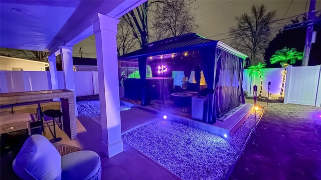 106 Hickory Ln, Levittown, NY 11756 - patio at night featuring a fenced backyard