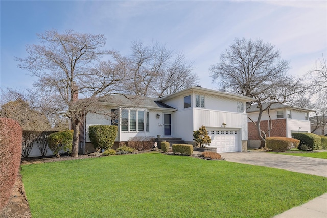 tri-level home with driveway, a front lawn, and an attached garage