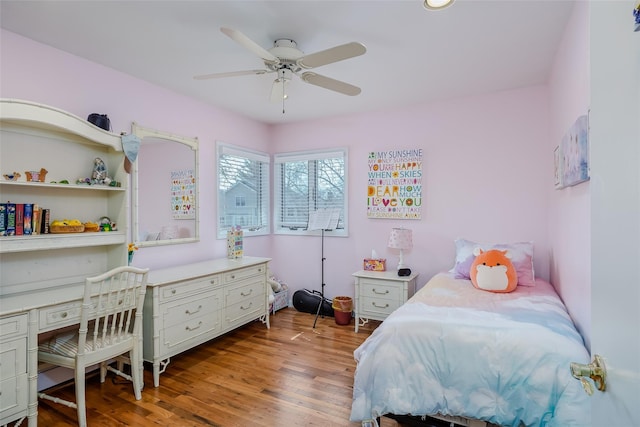 bedroom featuring wood finished floors and ceiling fan