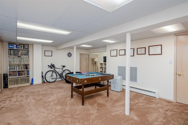 playroom with visible vents, baseboards, light colored carpet, a paneled ceiling, and a baseboard radiator