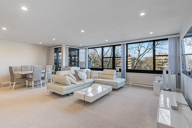 living area featuring recessed lighting and light carpet