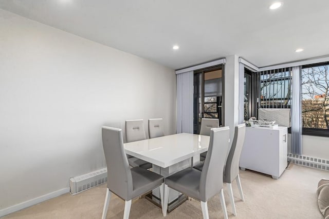 dining area with recessed lighting, baseboards, and light carpet