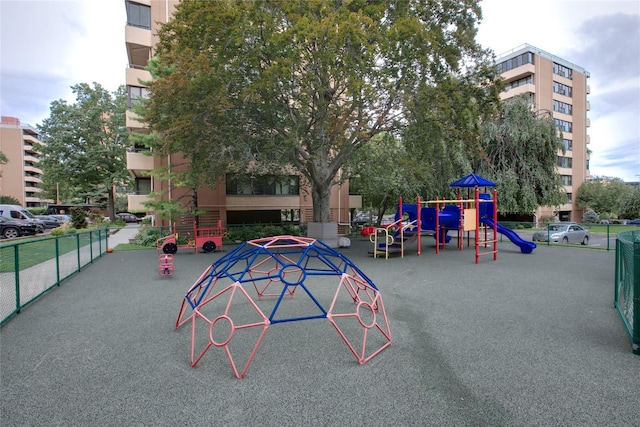 view of property's community with fence and playground community