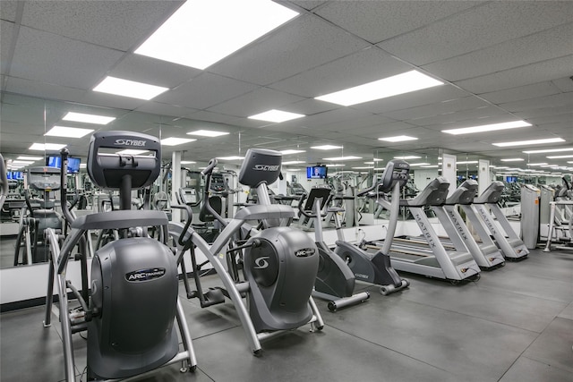 workout area featuring a paneled ceiling