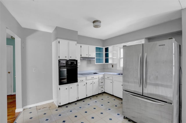 kitchen with baseboards, light countertops, white cabinets, black appliances, and open shelves