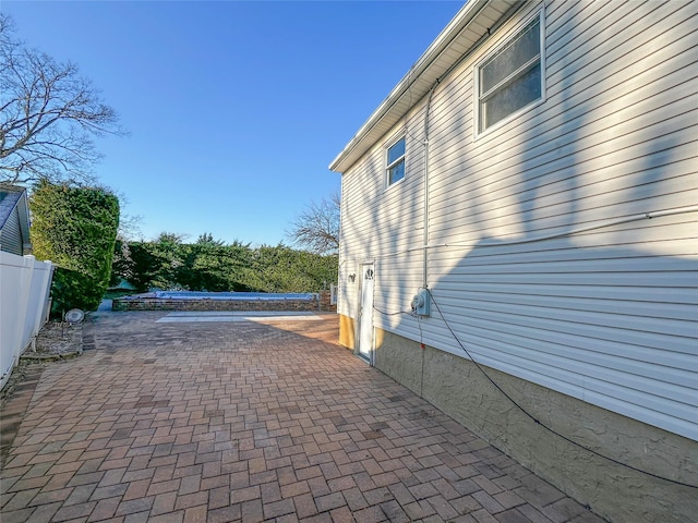 view of patio / terrace featuring fence