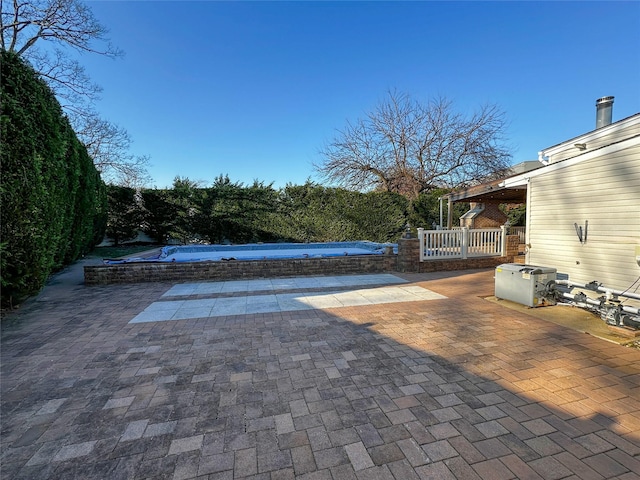 view of pool featuring a covered pool and a patio area