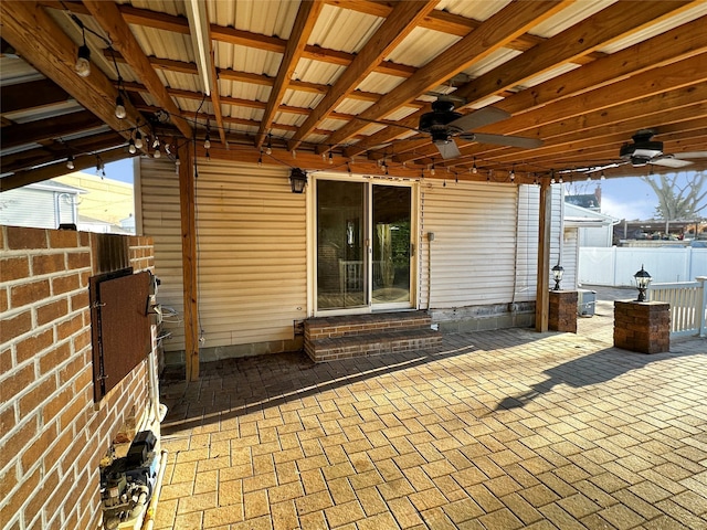 view of patio / terrace featuring entry steps, ceiling fan, and fence