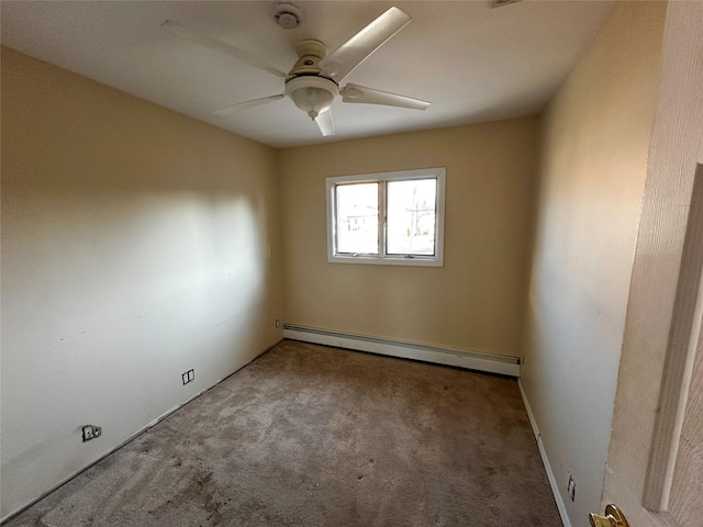 empty room featuring a baseboard heating unit, carpet floors, and ceiling fan