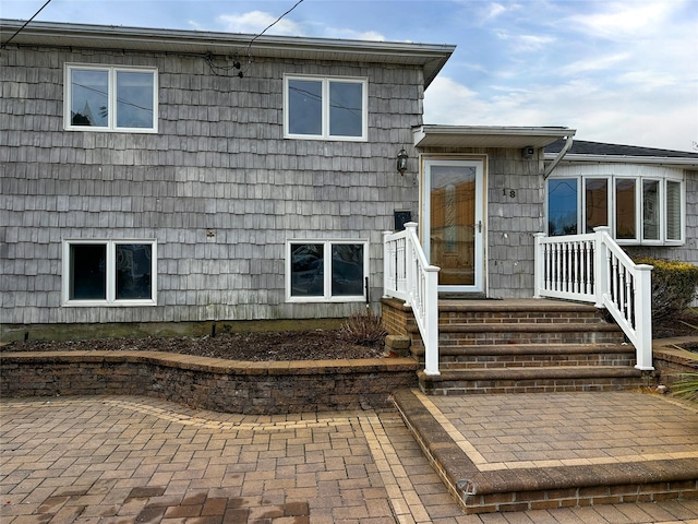 entrance to property featuring a patio