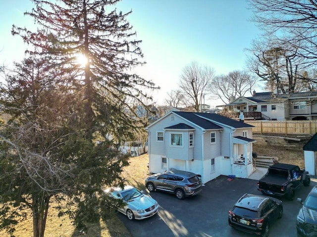 exterior space with fence and driveway