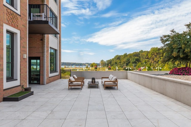 view of patio / terrace with an outdoor living space and a balcony