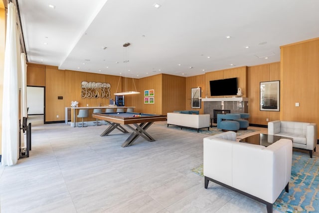 game room with recessed lighting, billiards, wooden walls, and a fireplace