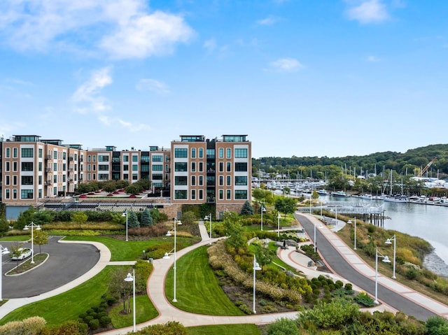 view of home's community with a water view