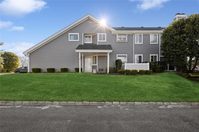 view of front facade with a front yard