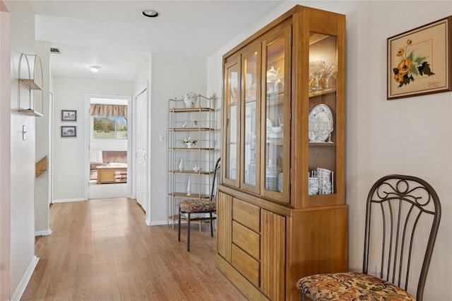 entrance foyer featuring visible vents, light wood-style flooring, and baseboards