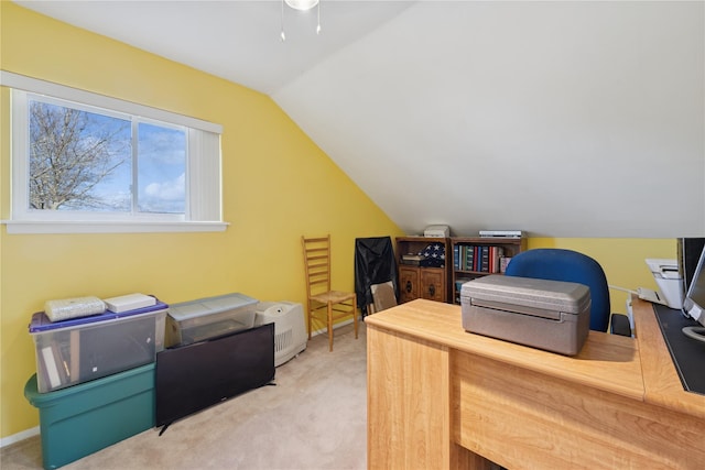 carpeted office featuring baseboards, lofted ceiling, and ceiling fan