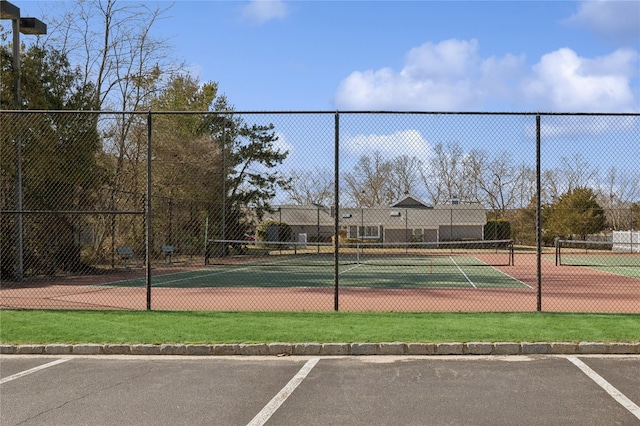 view of sport court with fence