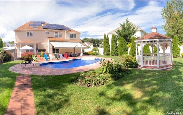 outdoor pool featuring a gazebo, a yard, a patio area, and fence