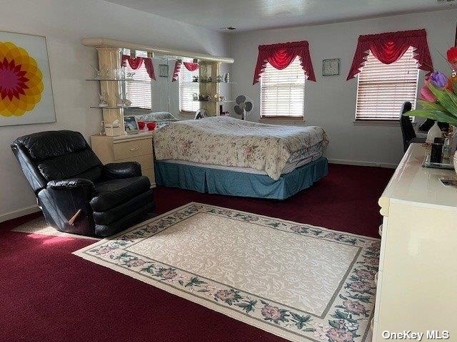 bedroom featuring baseboards