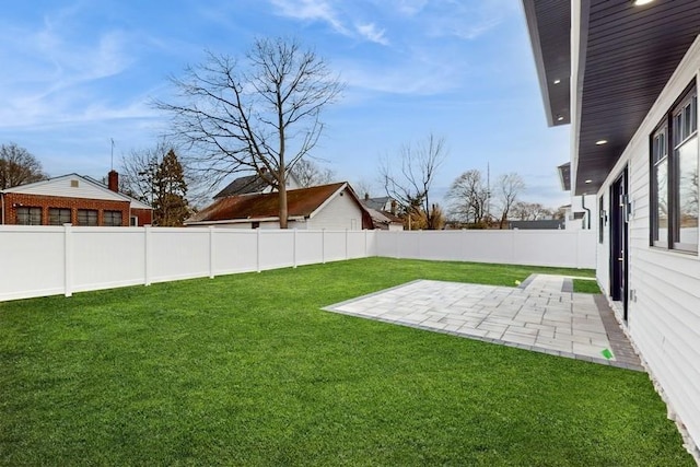 view of yard featuring a fenced backyard and a patio