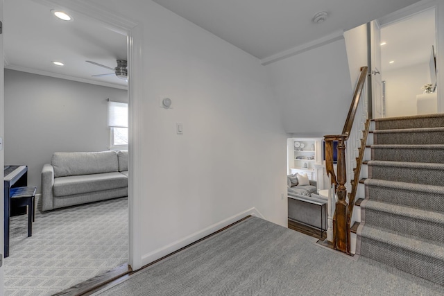 staircase with carpet, a ceiling fan, baseboards, recessed lighting, and ornamental molding