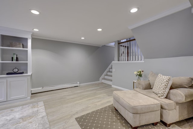 living area with stairway, ornamental molding, light wood-type flooring, and a baseboard radiator