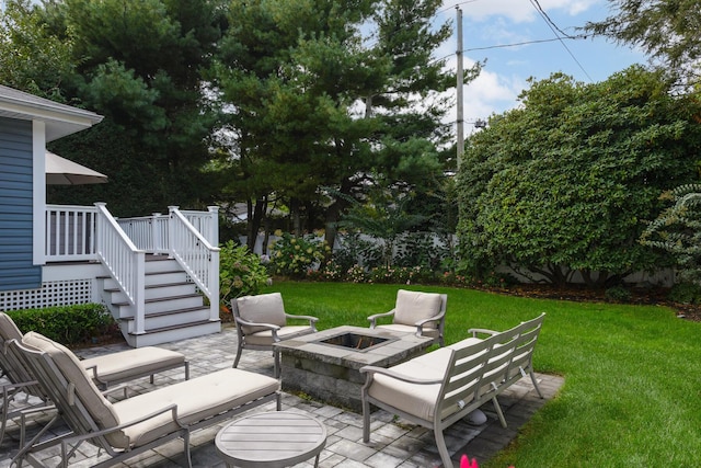 view of patio with a fire pit, a deck, and stairs