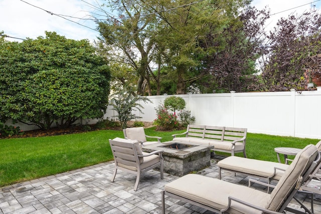 view of patio / terrace with a fenced backyard and an outdoor fire pit