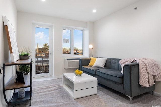 living room with carpet flooring, recessed lighting, baseboards, and a wall mounted AC