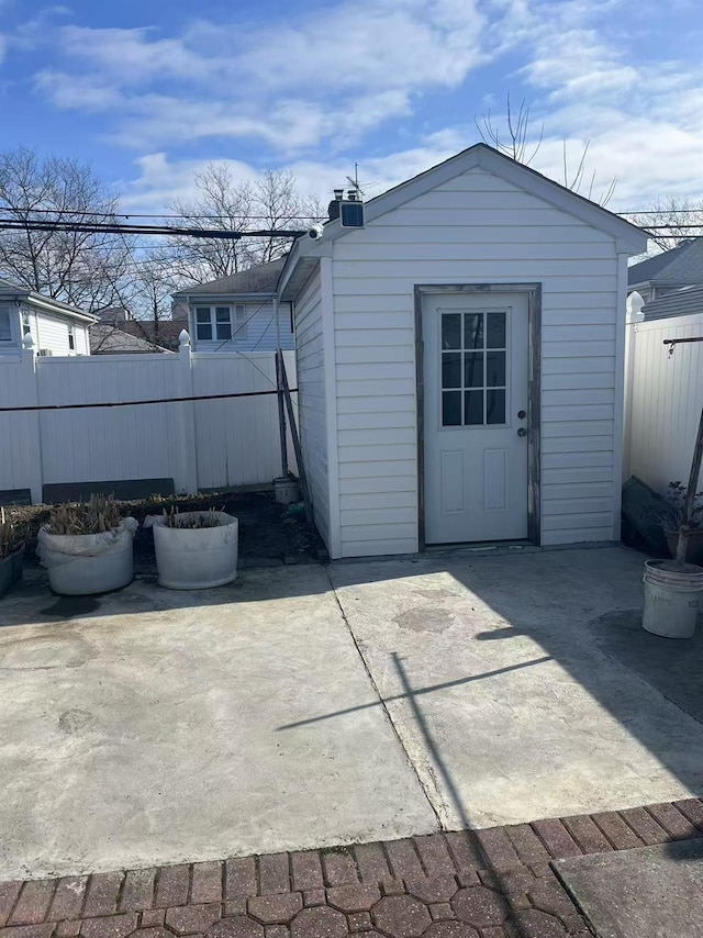 garage with fence