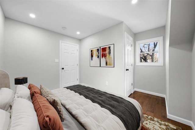 bedroom featuring recessed lighting, wood finished floors, and baseboards