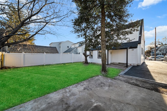 view of yard featuring a patio area and fence