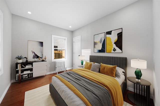 50 Cameron Ave, Hempstead, NY 11550 - bedroom with radiator heating unit, wood finished floors, and recessed lighting