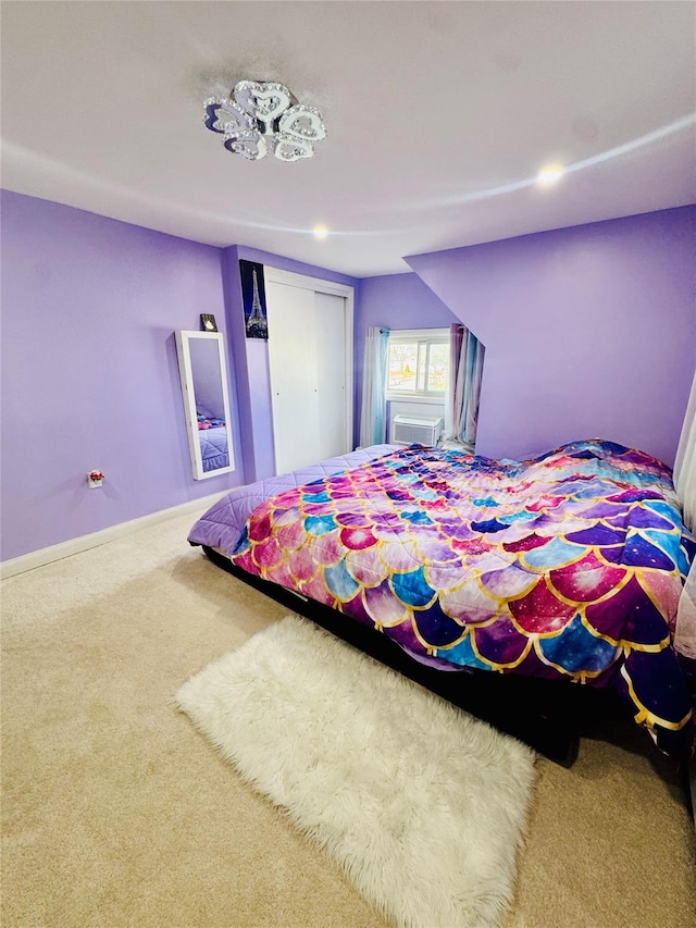 bedroom featuring carpet, a closet, and baseboards