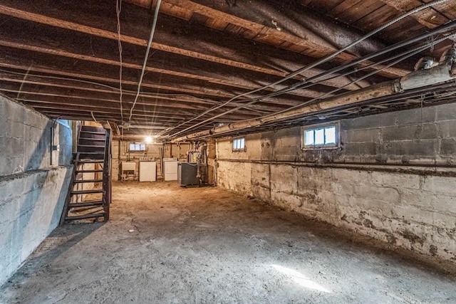 basement with separate washer and dryer and a sink