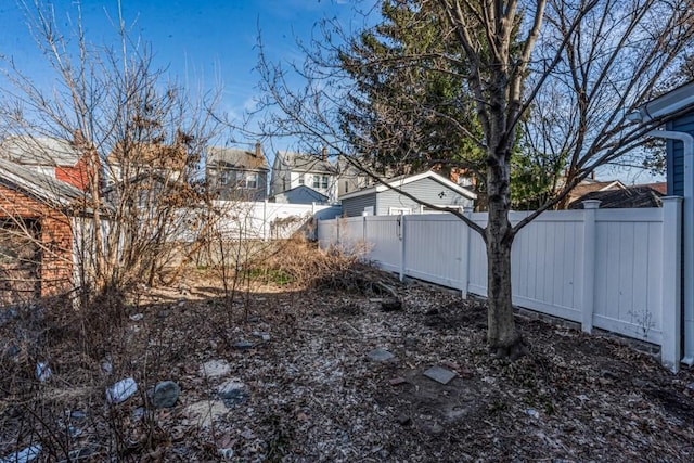 view of yard with a fenced backyard