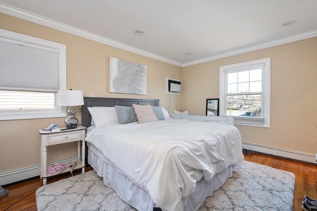 bedroom featuring wood finished floors, baseboard heating, and ornamental molding