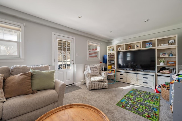 living room featuring baseboards and carpet flooring