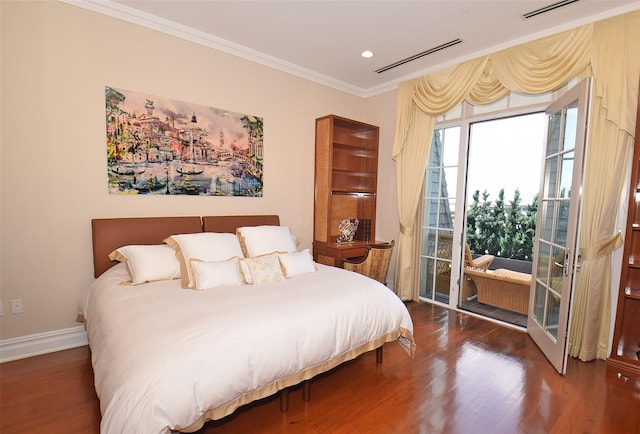 bedroom featuring access to exterior, visible vents, crown molding, baseboards, and wood finished floors